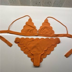 Marysia Swim orange scalloped bikini set.